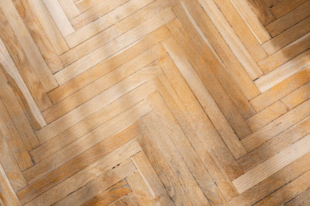 istock Herringbone pattern wooden floor showcasing natural textures in daylight 2186543904