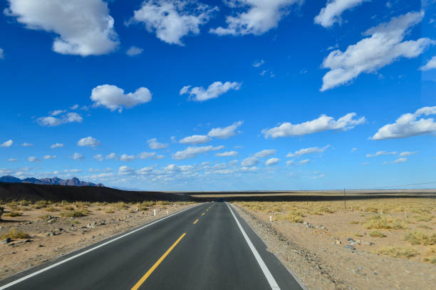 istock Desert road sand dunes in Xinjiang, China 2186549443