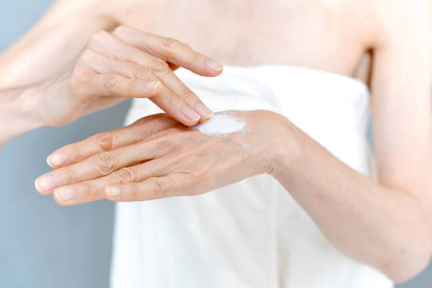 istock Image of a middle-aged woman applying cream to her hands 2186552609