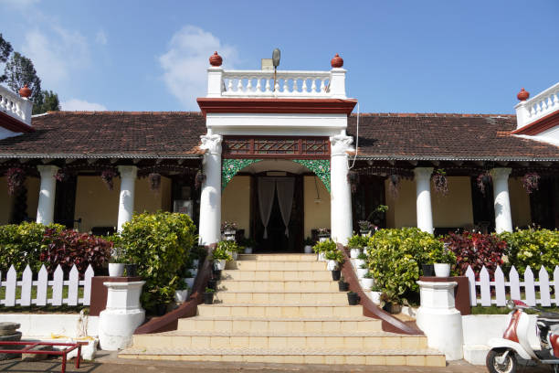 Bokor Hill, Kampot, Cambodia on Feb, 21, 2024: newly built but empty apartments being part of high end tourist resort at to be established Bokor City in the centre of Bokor National Park covering some 5percent of its surface.\n\nIn the early 1920s, the French built a hill station on the mountain as a retreat from the heat and humidity of the lowlands. The hill station included a casino, hotels and other amenities and quickly became a popular destination for French colonists and wealthy locals.\n\nDuring the Khmer Rouge regime in the 1970s, the hill station was abandoned and fell into disrepair. The buildings were looted and damaged and the jungle began to reclaim the land. In the years following the Khmer Rouge regime, the hill station remained largely abandoned, with only a few small villages and a handful of tourists visiting the area.\n\nIn the early 2000s, a group of investors led by Cambodian businessman Sok Kong began a massive renovation project to transform the hill station into a luxury hotel and resort. The project, which cost over $100 million, involved the restoration of several historic buildings, including the Bokor Palace Hotel and the casino, as well as the construction of new buildings, including a golf course and a luxury spa.