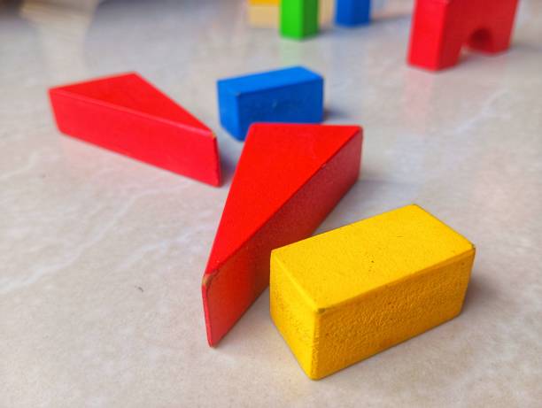 closeup photo of wooden block toys on the floor