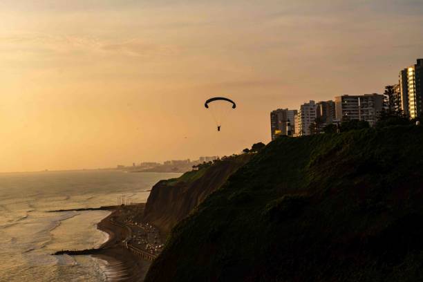 istock Coast view at the sunset and paraglinding 2186565409