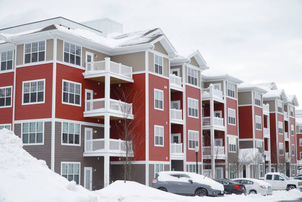 istock modern apartment building after winter snow storm 2186569830