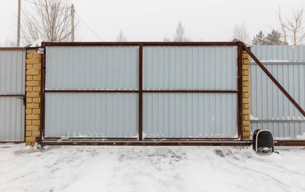 istock A gate is open and snow is on the ground 2186582568