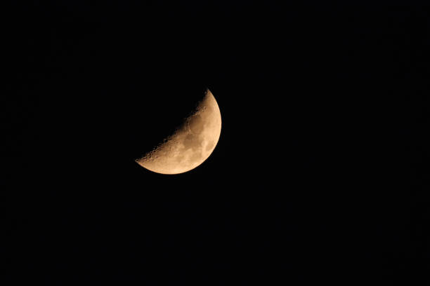 istock Golden Yellow First Quarter Moon 2186582782