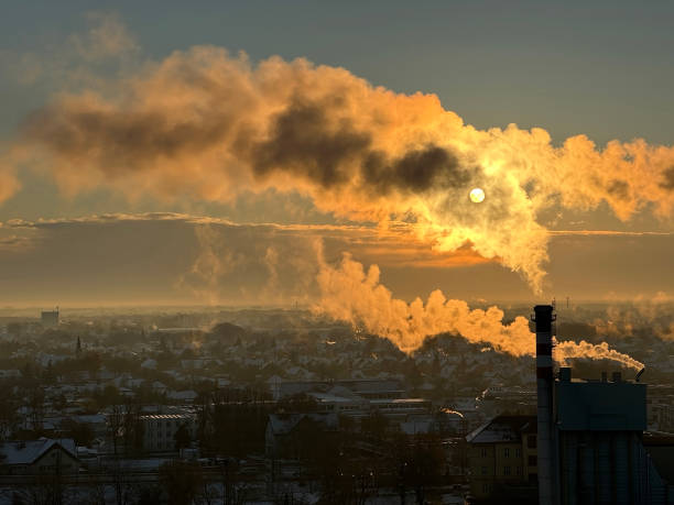 Smoking industrial smoke stacks in winter time