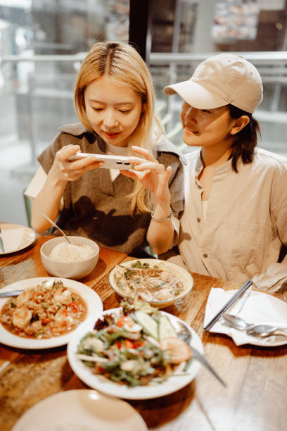 istock Friends capturing memories of a shared Thai dining experience 2186588015