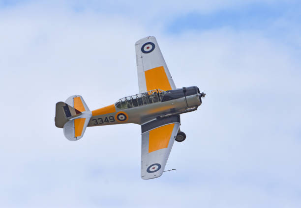 Little Gransden, Cambridgeshire, England -  August 25, 2024: Vintage  North American NA-64 Yale Second World War training plane in flight