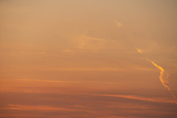 summer evening, sunset in yellow, orange and pink with clouds, background