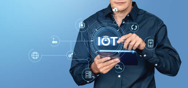 istock A man operates a tablet with holographic IoT icons surrounding h 2186592396