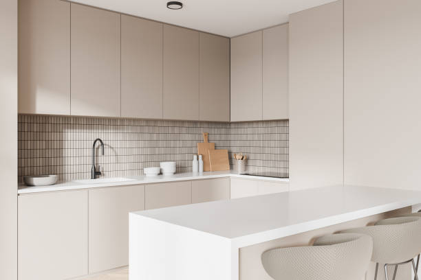 istock Modern kitchen with beige cabinets and island. 3D Rendering 2186593224
