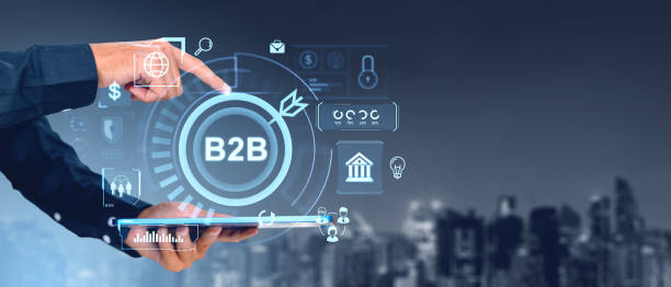 istock Businessman interacting with B2B interface on digital tablet in cityscape background. 2186594203