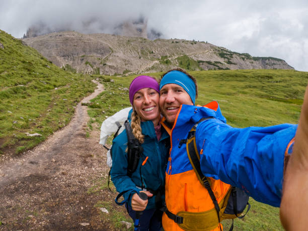 istock Smiling Hikers Capturing a Moment on Mountain Trail 2186595538
