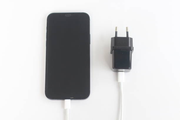 istock A smartphone that is charging by connecting to a cable 2186595804