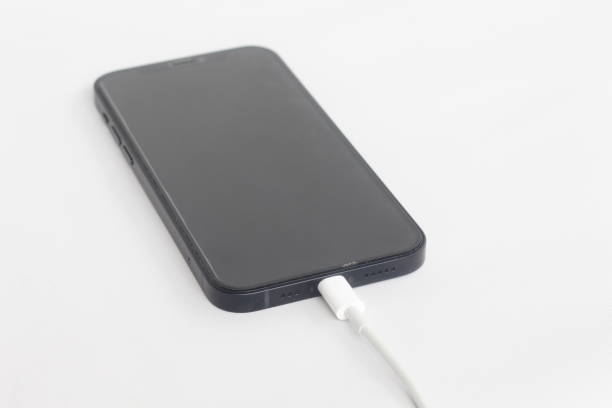 istock A smartphone that is charging by connecting to a cable 2186595805