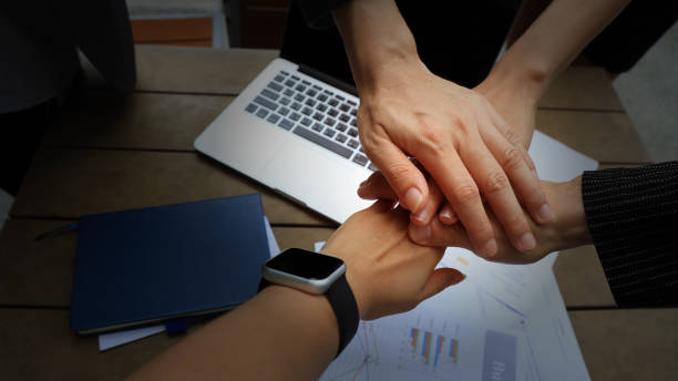 istock Teamwork Concept,Group of diversity people to greeting power tag team,Teamwork Join Hands Partnership Concept of people putting their hands together,Friends with hands showing unity. 2186599883