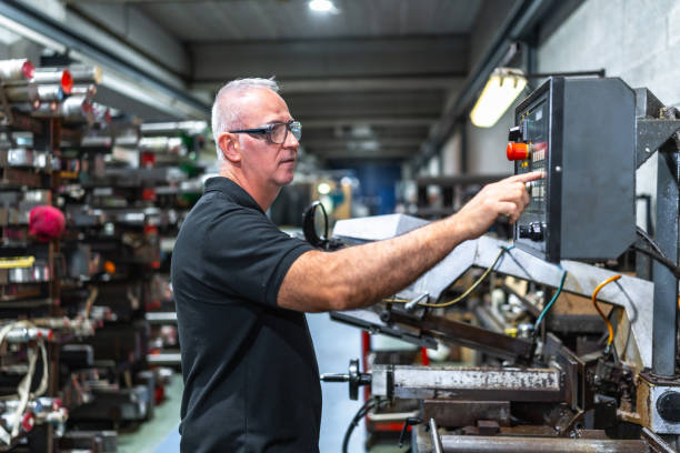 istock Man operating in the control station of a mechanical saw 2186601529