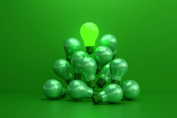 Distinctive shine bright light bulb floats above the green light bulb. concept of green idea energy saving, Innovation and inspiration.