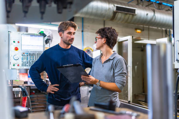 istock Engineer and manager doing inventory and talking in a factory 2186601727