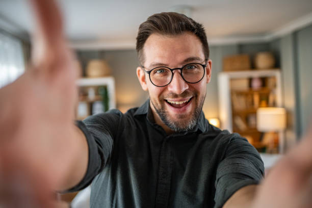 istock Man talking and looking at camera, recording video for his vlog 2186609289