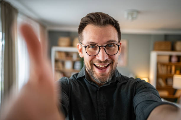istock Man talking and looking at camera, recording video for his vlog 2186609290