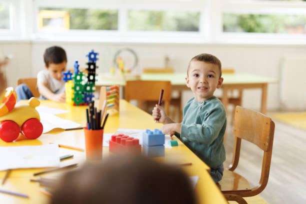 istock Little boy drawing in kindergarten 2186609322