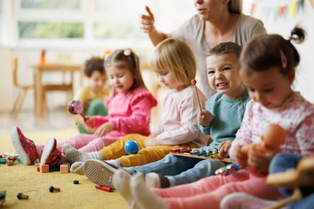 istock Children play musical instruments in kindergarten 2186609713