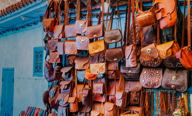 A vibrant display of handcrafted leather bags in moroccan’s souk