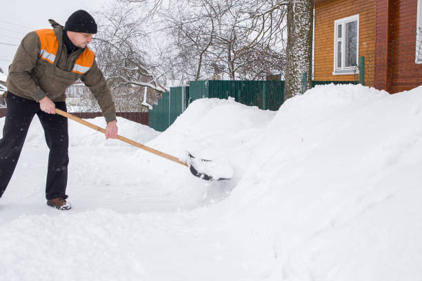 istock man removes snow with a shovel 2186610411