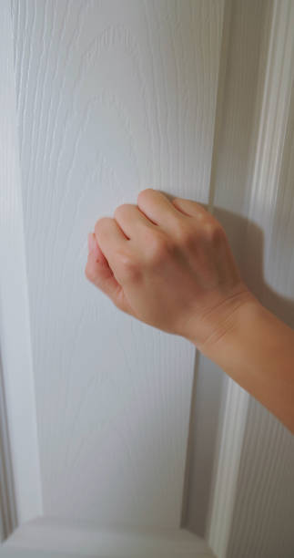 istock woman keep knocking on door 2186613291