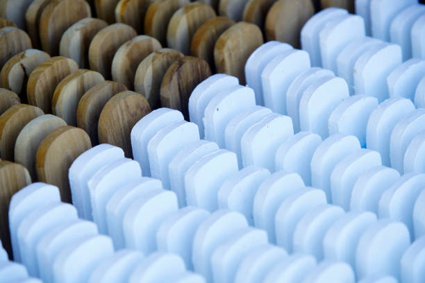 This image showcases a beautifully arranged array of wooden and white shapes, highlighting their distinct textures and patterns. Ideal for design inspiration.