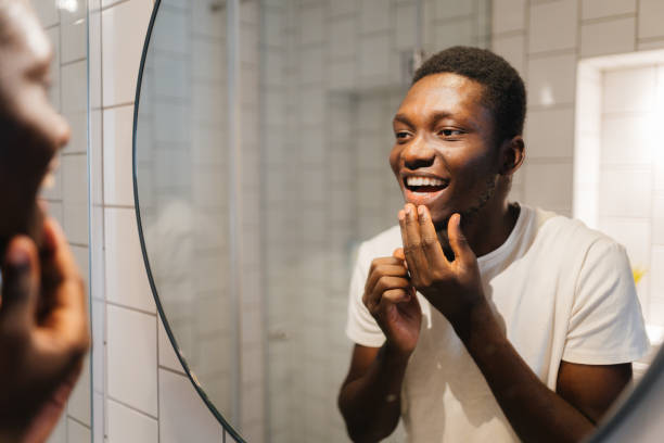 istock Man's daily skin care routine in the bathroom 2186615574