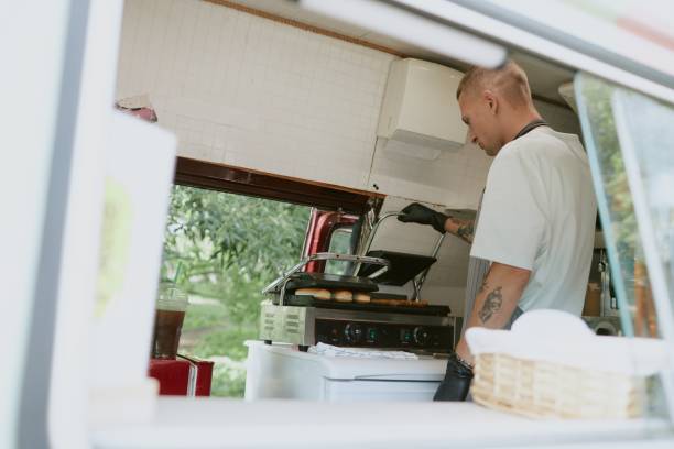 istock Male Cook Checking Food on Grill 2186618590