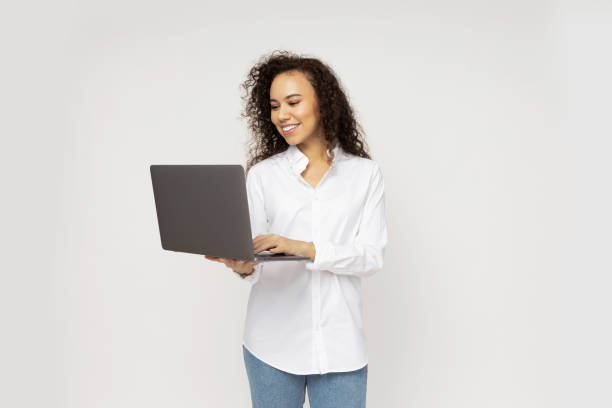 istock Young attractive girl with laptop in hands 2186618920