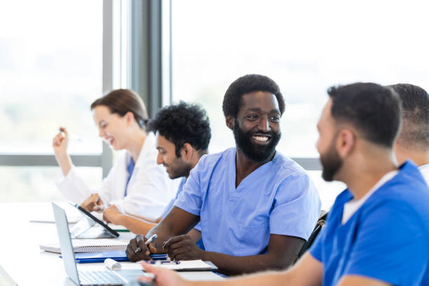 istock Happy male medical student talk with friends before class 2186628265