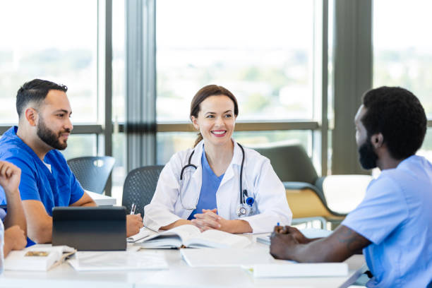 istock Cheerful female medical student in study group 2186628329