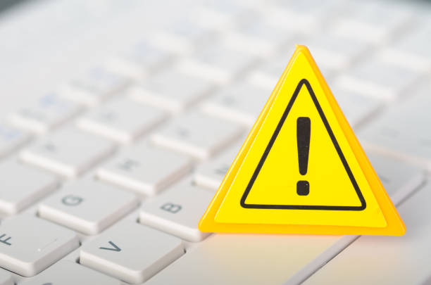 istock Warning Sign with Keyboard: Digital Safety, Online Security, and Technology Concept for Alert and Awareness 2186631353