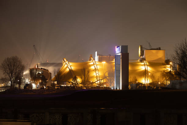 Hamburg, Germany – February 19, 2023: A hazy night view of Hafencity harbor in Germany with fog and atmospheric lights.