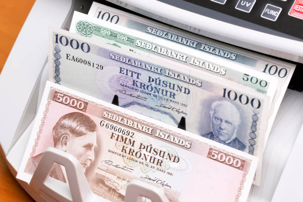 istock Old Icelandic money in a counting machine 2186631699