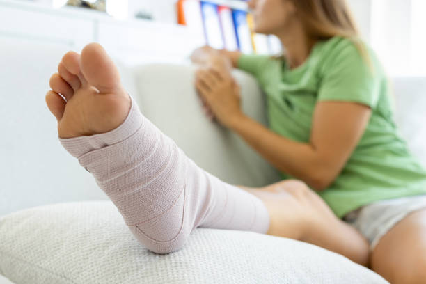 istock Young woman with injured leg 2186632388