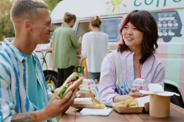 istock Happy Couple Enjoying Meal Under Open Sky 2186632426