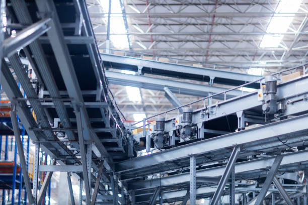 istock View of modern conveyor belts transporting boxes in a large warehouse ready for delivery. logistics. 2186632487