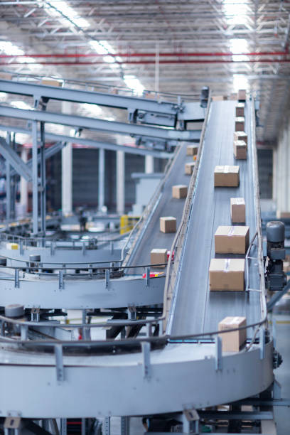 istock View of modern conveyor belts transporting boxes in a large warehouse ready for delivery. logistics. 2186632503