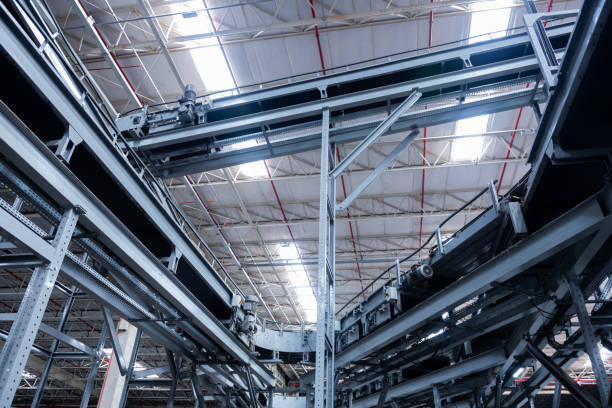 istock View of modern conveyor belts transporting boxes in a large warehouse ready for delivery. logistics. 2186632702