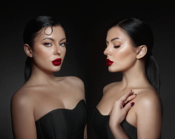 istock striking visual features a woman with bold red lips and a shiny sleek hairstyle, showcasing her beauty in a dark, elegant setting. two poses highlight her confident demeanor 2186633054