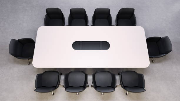 istock spacious conference table is centrally placed in a minimalist office with black chairs arranged around it. This setup is ideal for team meetings and collaborative discussions. 3d render 2186633101