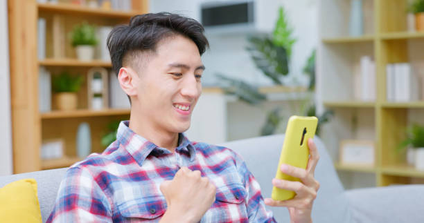 istock asian guy smartphone stock market 2186637909