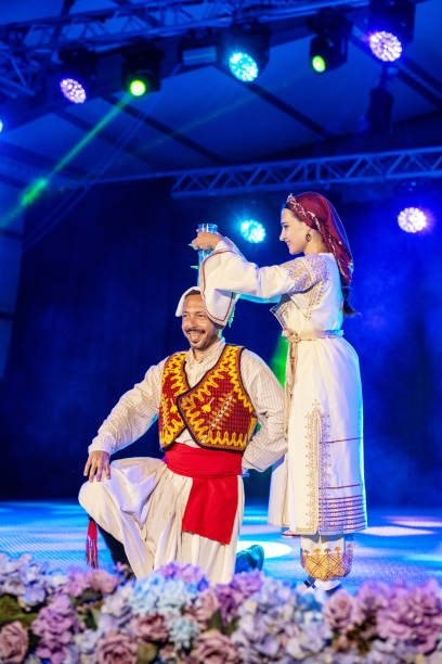 Koprivshtica, Bulgaria - August 10, 2025: People in traditional folk costume of The National Folklore Fair in Koprivshtica. The National Folklore Fair in Koprivshtica is entered in the UNESCO Register of the human intangible cultural heritage