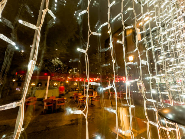 Christmas decoration lights on store window in Barcelona, Spain
