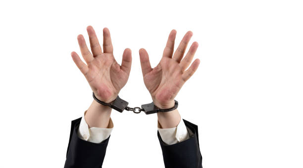 istock Businessman's hands in steel handcuffs 2186641339